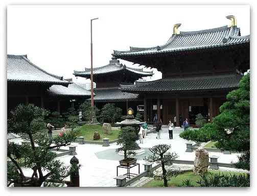 Hall of Celestial Kings on one end of the  courtyard dotted with bonsai trees