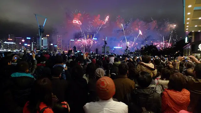 Crowds of spectators watching Chinese New Year fireworks