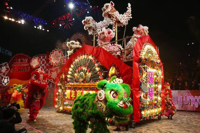 Entertainers perform lion dance during the opening ceremony of the