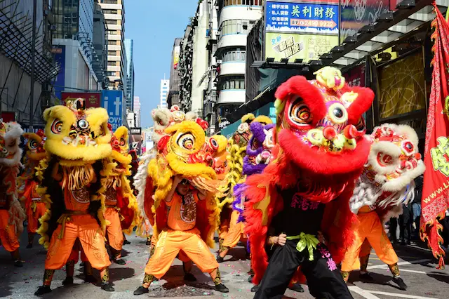 Hong Kong Dragon and Lion dance Festival Parade in streets of Kowloon