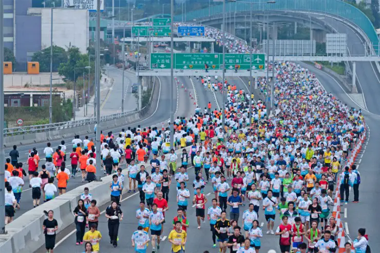 Hong Kong Marathon runners over the bridge
