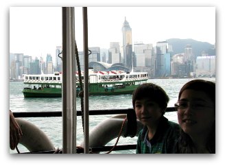 Kids riding the Star Ferry Hong Kong