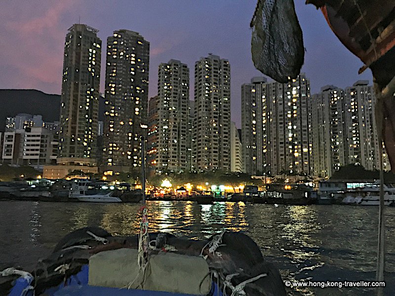 Aberdeen Village Harbour and background highrises at night